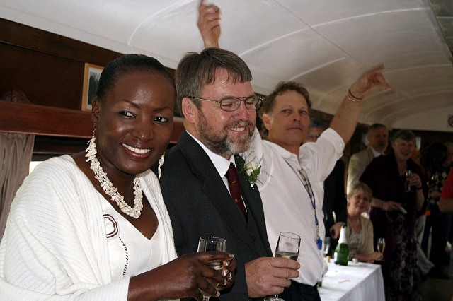 Nathan airs his armpits in the open coach while John and jane smile politely